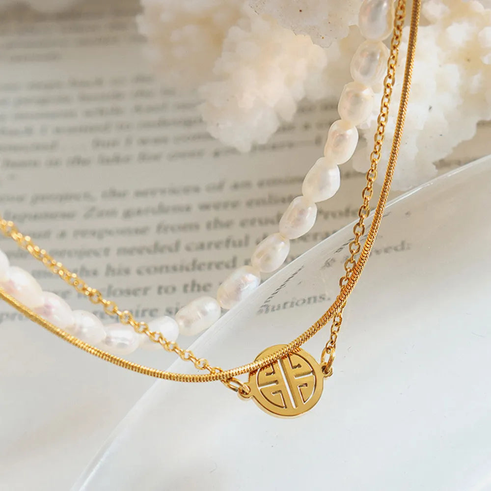 Pulsera de perlas de tres capas en acero de titanio