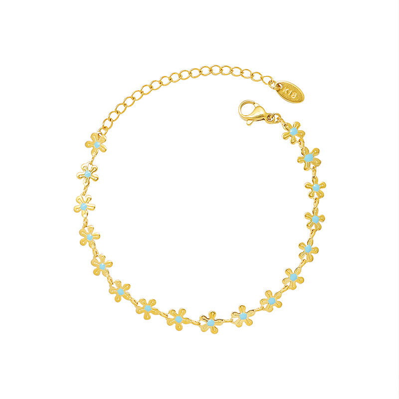 Pulsera Flor de Oro con Detalle Azul – Acero de Titanio